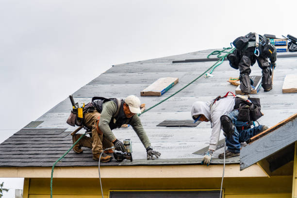Professional Gutter Installation technician working in Newton Lower Falls, MA
